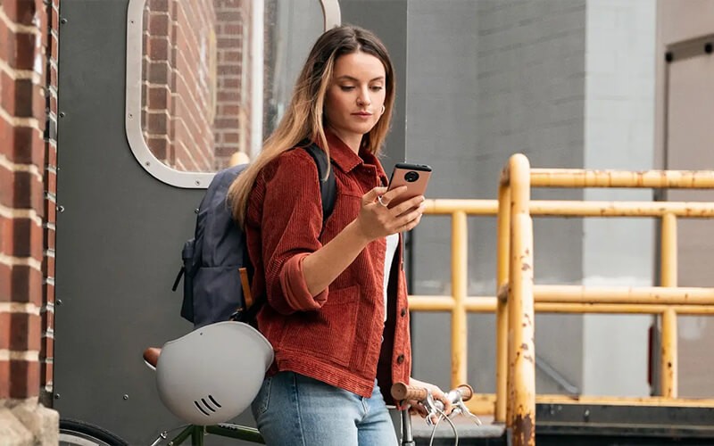 Flexible setup and management options Woman using her smart phone outside