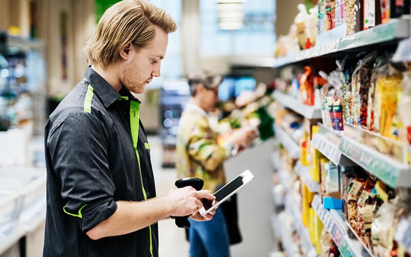 Remove barriers for your front-line team. Man checking the products