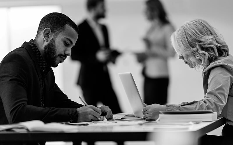 Grammarly for Business Two colleagues working together