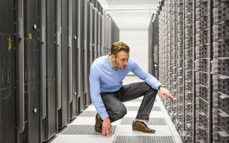 HPE keeps your network safe Man working in server room