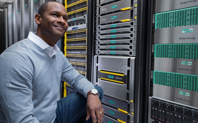 HPE hybrid IT solutions Man smiling in server room