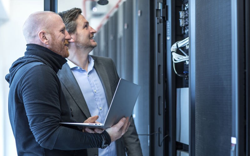 IBM storage solutions Two men looking at servers