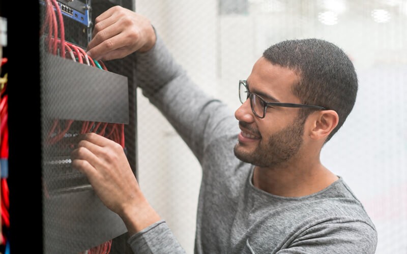 IBM data storage systems Men working in data center