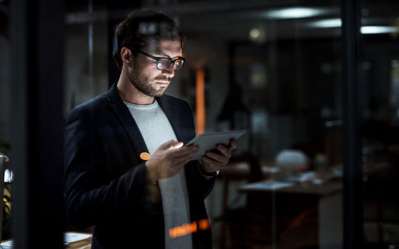 Mobile Device Management (MDM) solution Man using tablet device