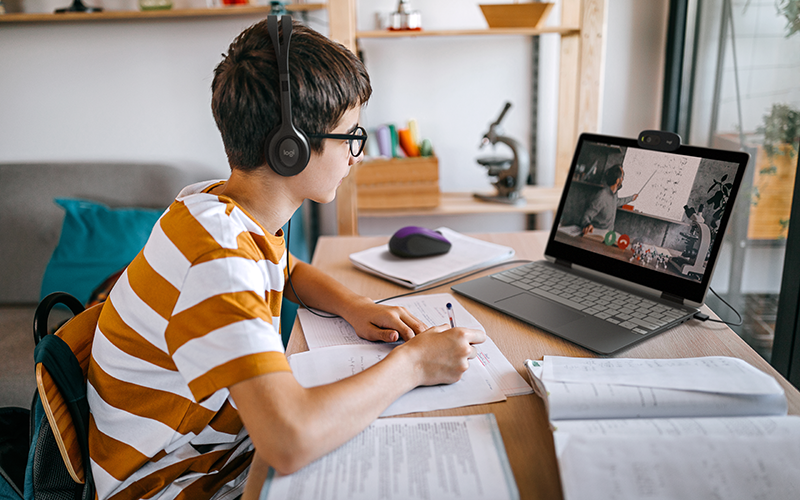 Designed to do more Young boy learning online