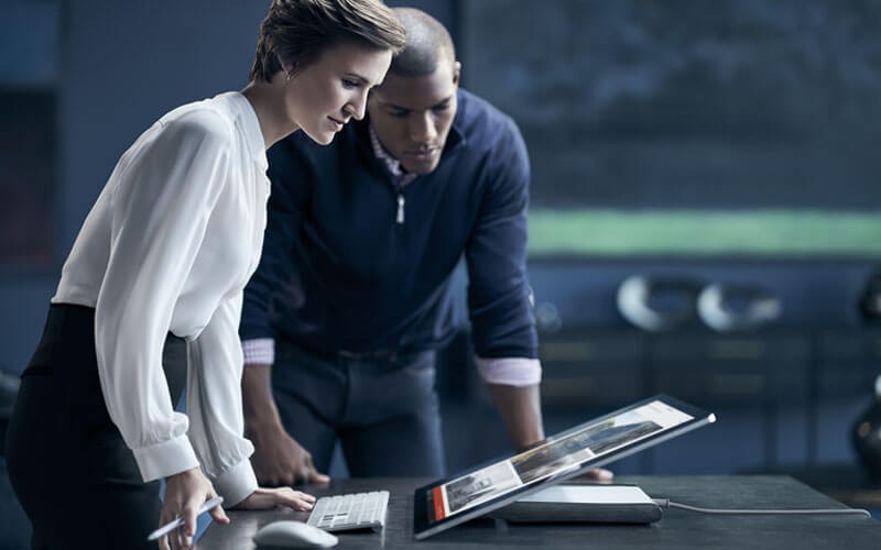 Microsoft Azure for agencies Woman working on Surface Studio