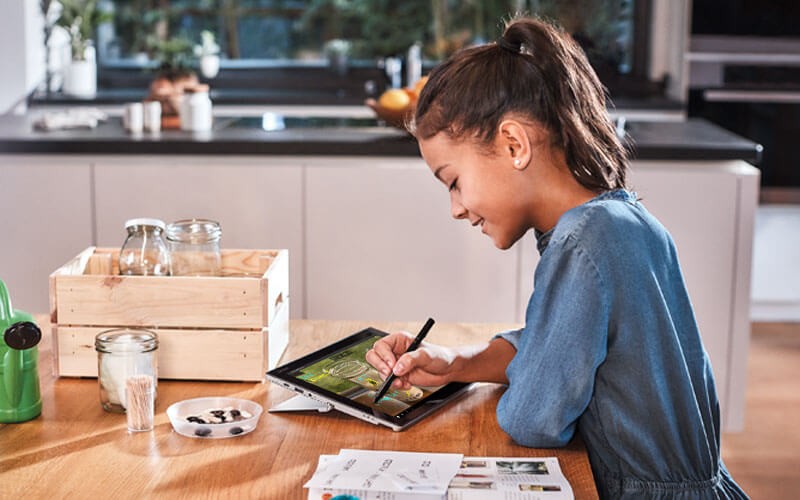 Insight and Microsoft devices and applications for education Elementary student working on tablet device
