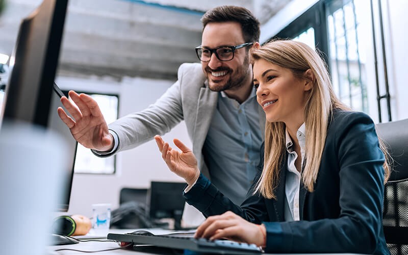 Introducing the New Commerce Experience. Two person working together