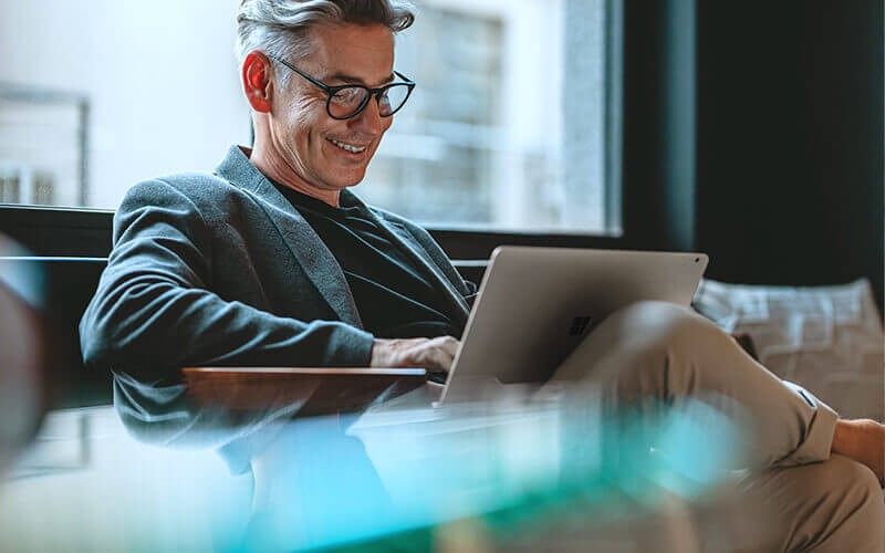 Seat-based offers Man sitting while using his laptop