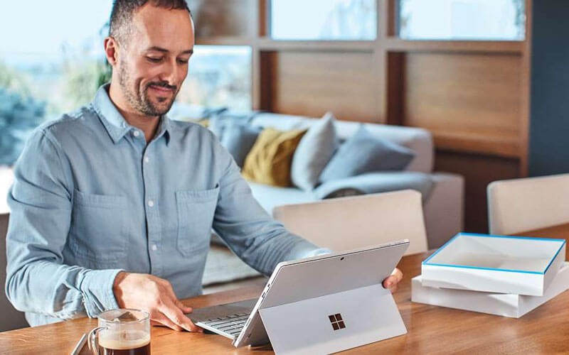 Windows Autopilot optimizes device setup Male opening Microsoft device for setup