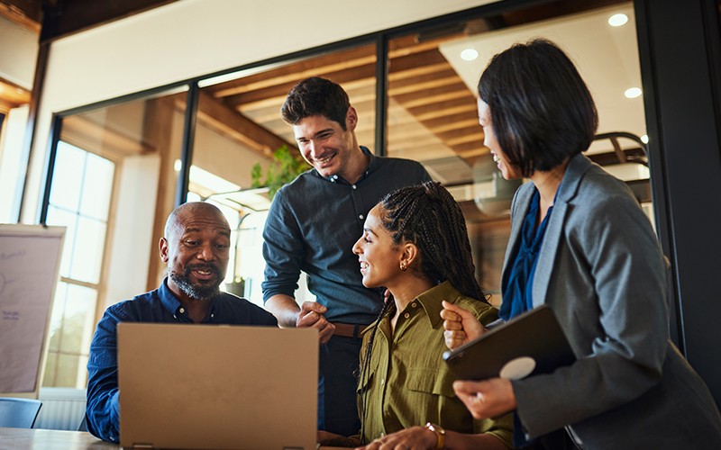 team-working-around-table-in-office-smiling-lifestyle team-working-around-table-in-office-smiling-lifestyle
