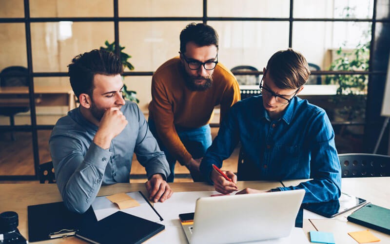 team-of-three-working-in-modern-office team-of-three-working-in-modern-office