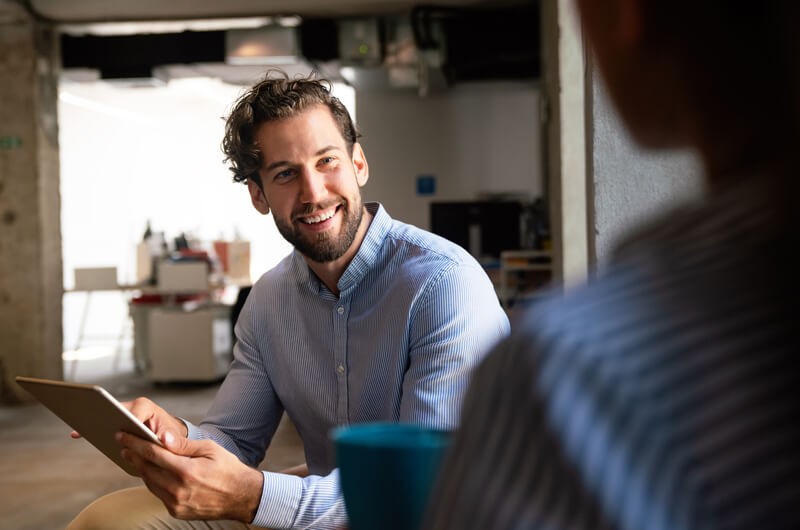 Insight was the first NetApp Cloud First Partner Smiling business professional using cloud computing capabilities from NetApp