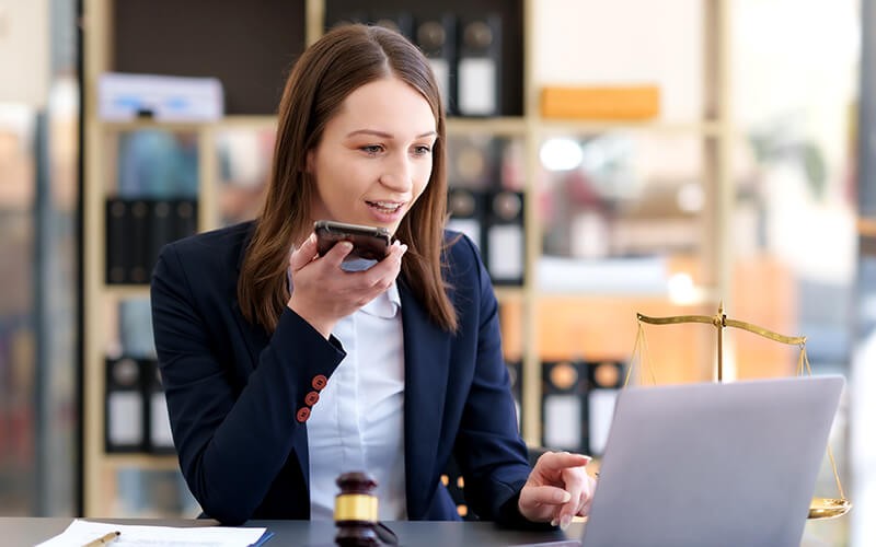 Dragon Legal Anywhere A Woman professional working with Nuance product solution
