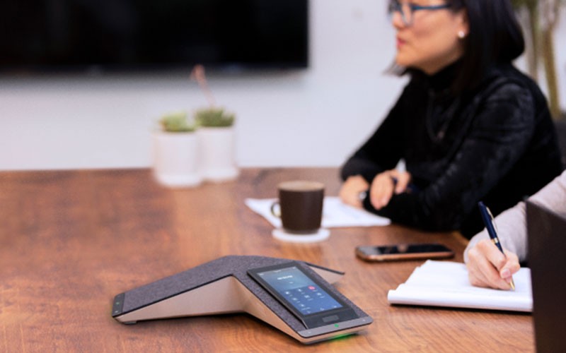Polycom conference phones deliver the clearest sound Group of people using Polycom phone