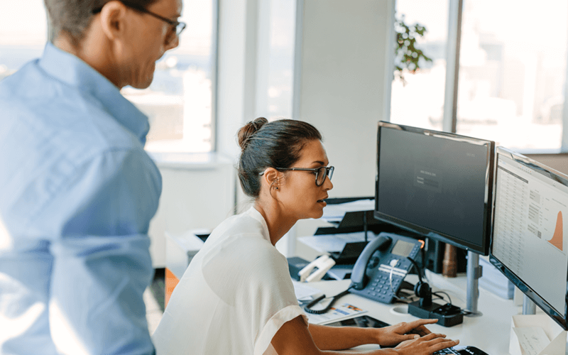 Quest ZeroIMPACT Male and woman looking at desktop