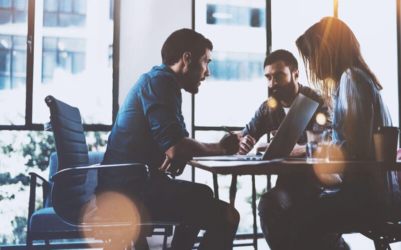 Synchronize your security management Coworkers working together