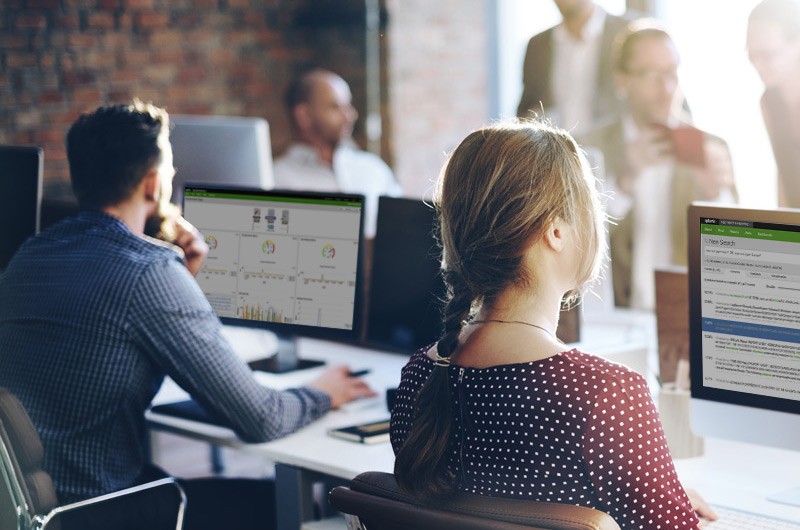 Configure all account policies according to your unique requirements Team reviewing data security requirements off desktop computer