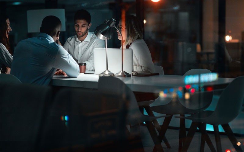 Protect accounts from cyberthreats Team working at night together