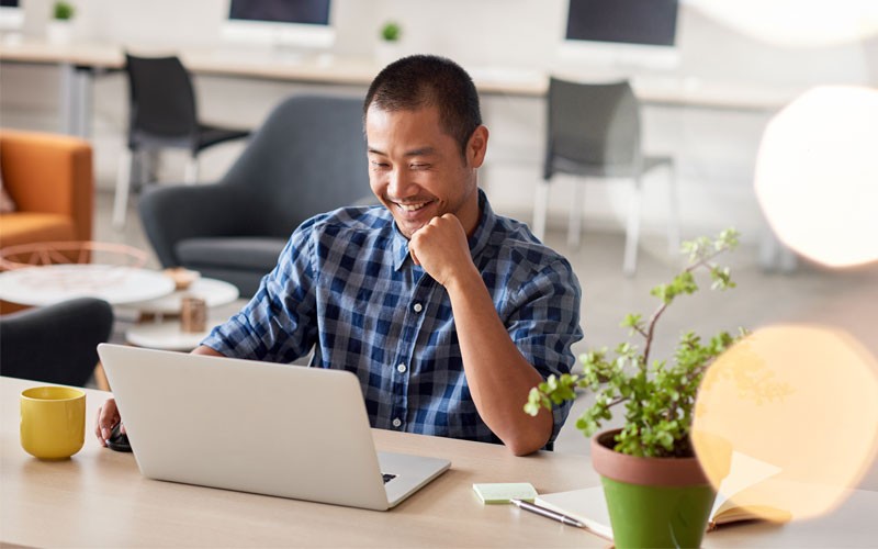 Online meetings and web conferencing Man working on laptop