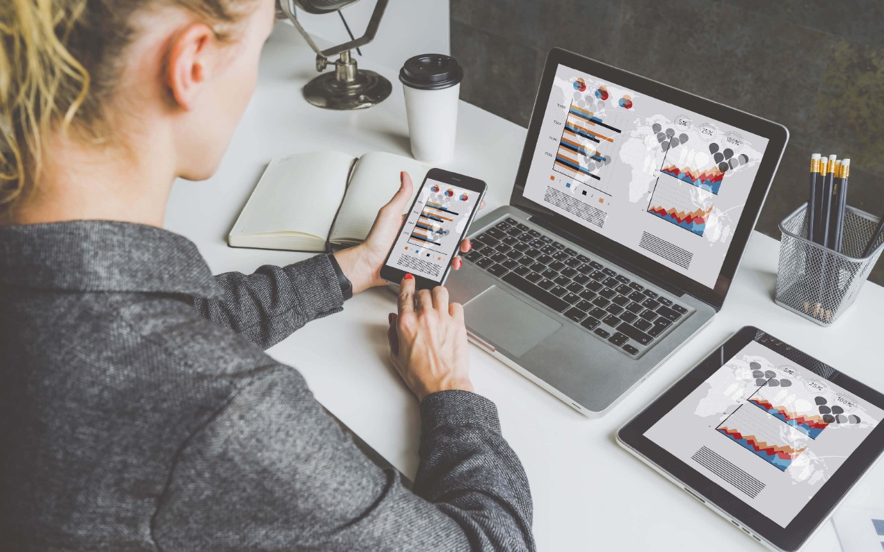 A holistic approach to data protection Woman using her devices at work