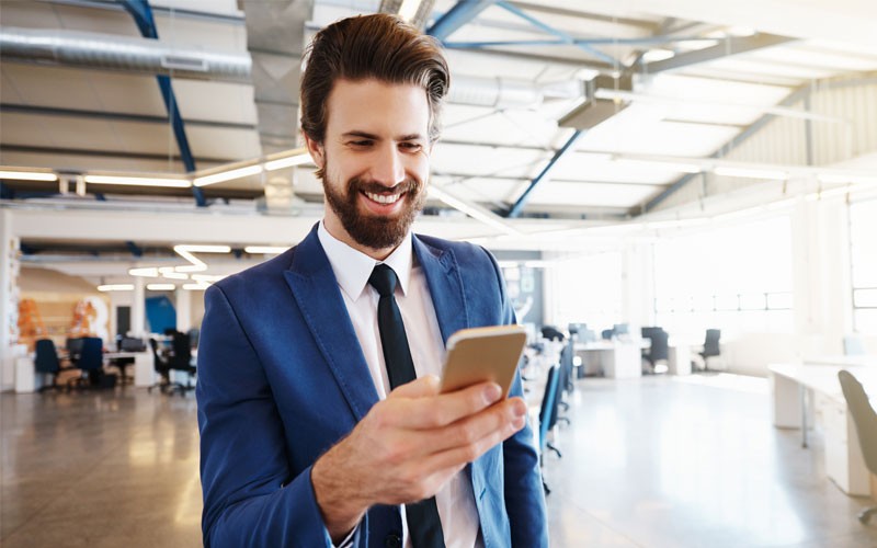 Federal government technology Business man looking at mobile phone