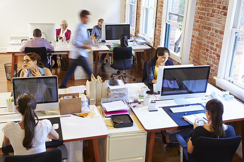 Compatible with on-premise environments View of business professionals working in office environment