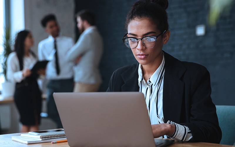 Application availability and mobility in private cloud environments Two employees working in office at night