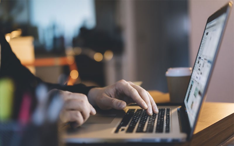 VMware AppDefense protects all applications User typing on laptop keyboard
