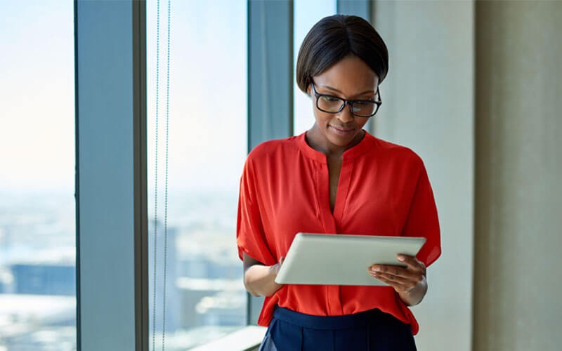 WatchGuard offers Network security A business woman working productively using his tablet