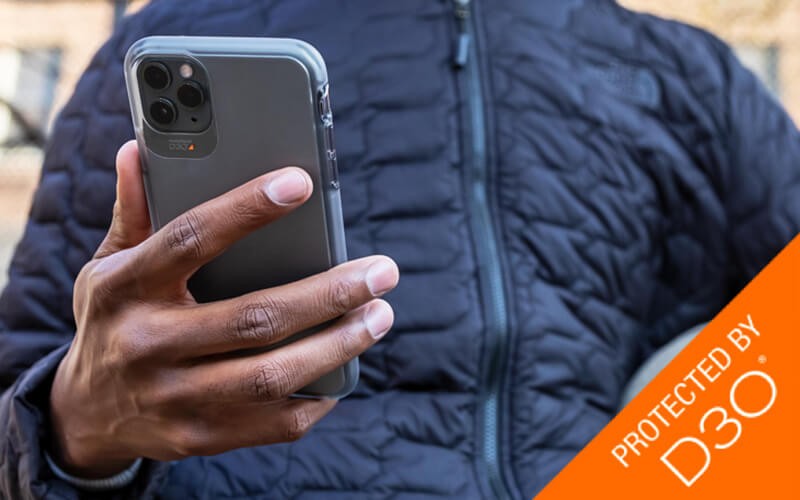 Man holding phone with ZAGG protection case