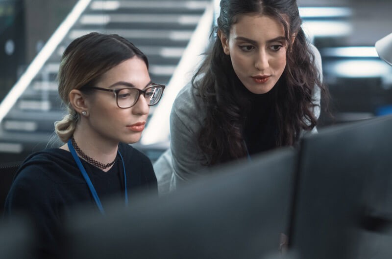 Ensure your backups are well protected and your disaster recovery is prepared for modern demands Close up discussion between two network administrators