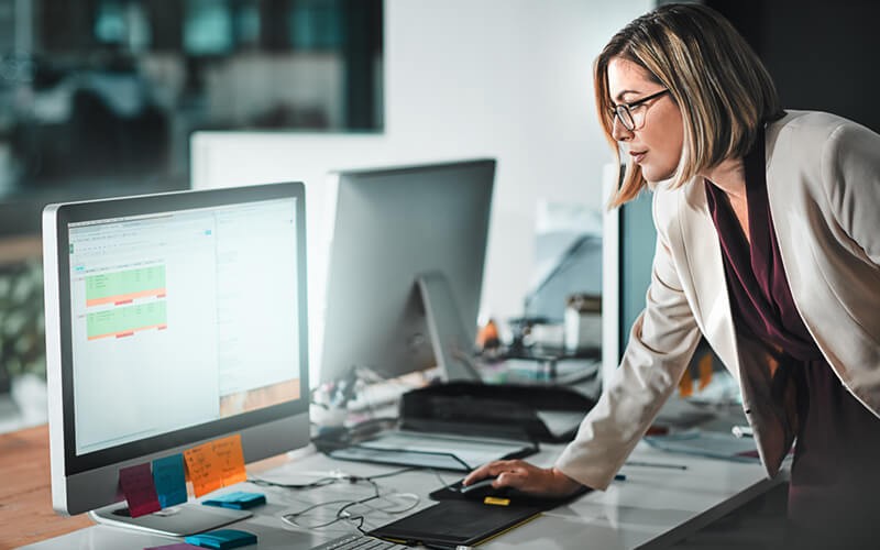 Gain peace of mind knowing your data and infrastructure are safe Businesswoman monitors data and security on computer