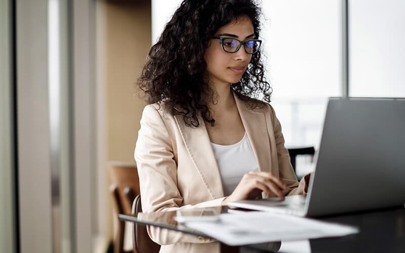 Broad visibility lets you automatically direct users to tailored views Business professional scanning documents on laptop computer