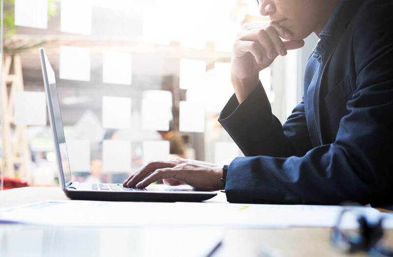 investor-reviewing-data-off-laptop-screen investor-reviewing-data-off-laptop-screen