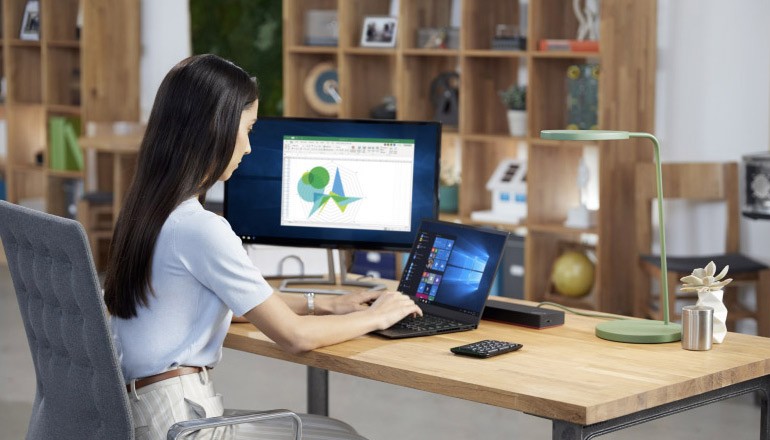 Woman working on Microsoft devices