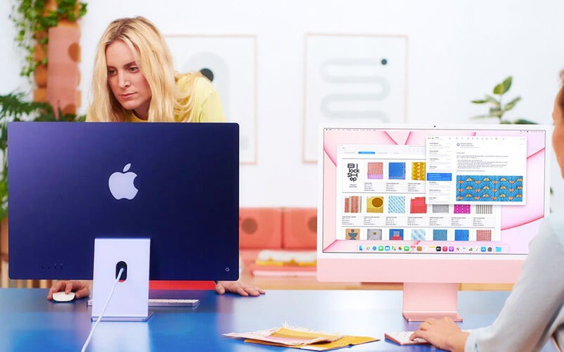 Evolve your workplace technology. Woman working on a desktop computer