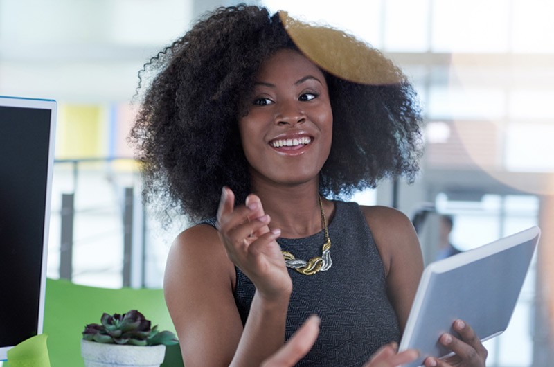 Meraki Systems Manager for mobile security Young african american woman holding tablet