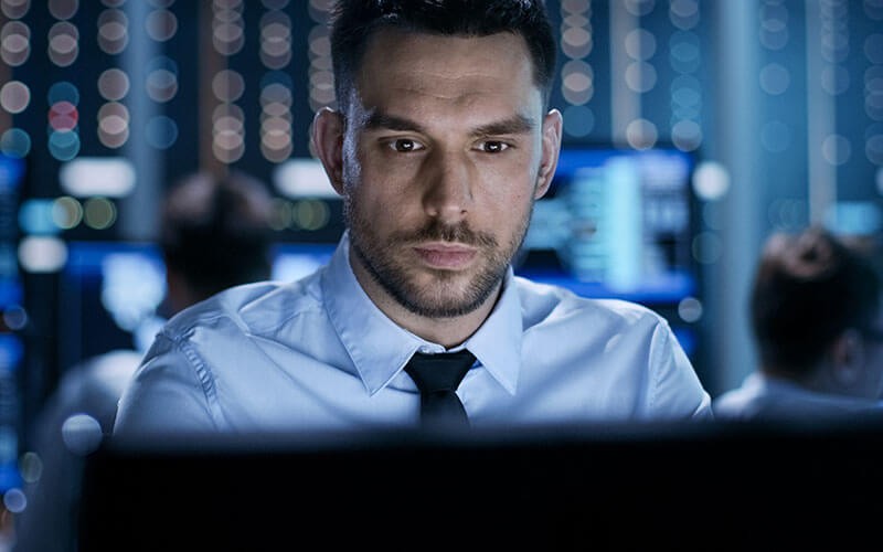 Eaton software Man looking at monitor screen