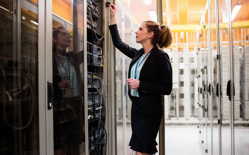 Woman working in server room