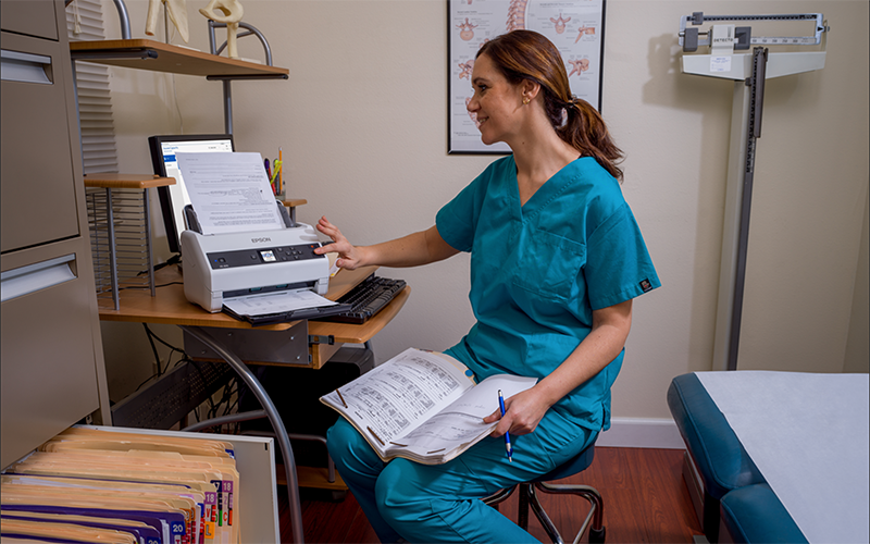 Healthcare woman printing using Epson printer