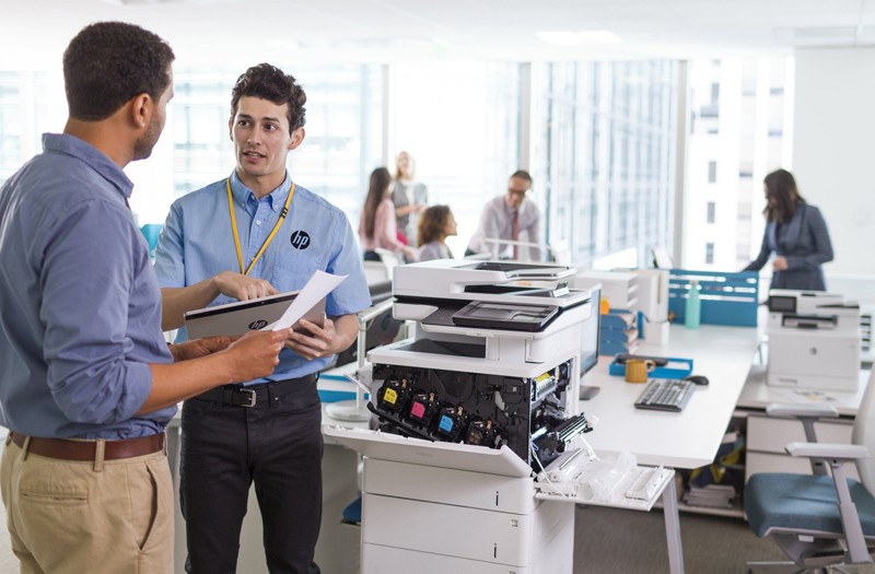 Printer technician checking the HP Color LaserJet Enterprise Flow MFP M577z