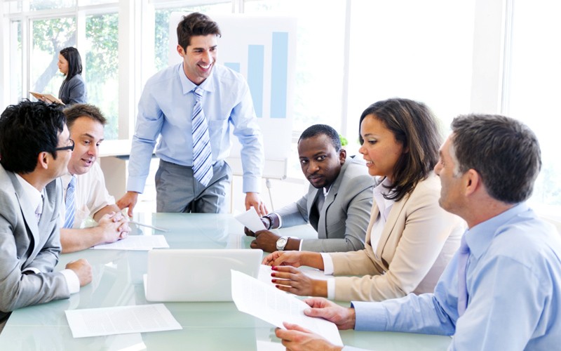Organizations everywhere trust our public sector arm for procuring Team around desk discussion