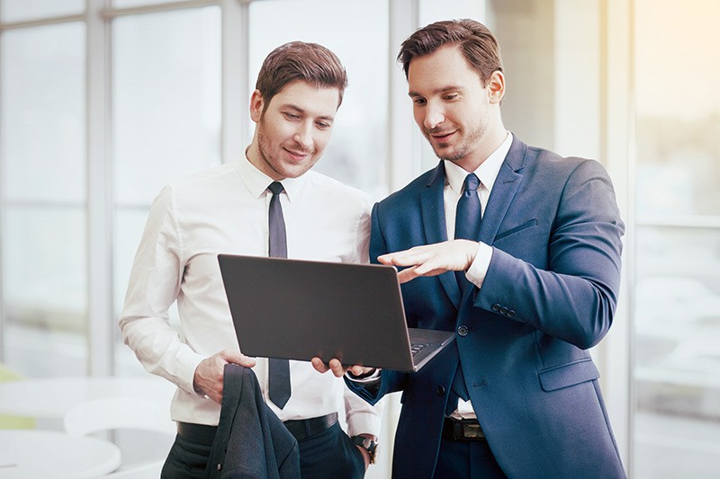 businessmen-making-project-with-a-laptop