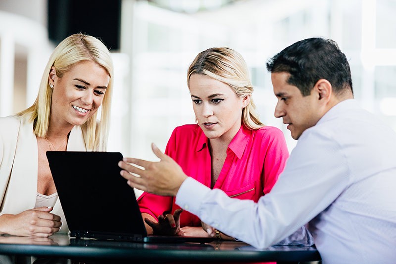 Include bundled Microsoft cloud programs: Office 365, Azure and Microsoft Dynamics CRM Online Team meeting around a notebook computer
