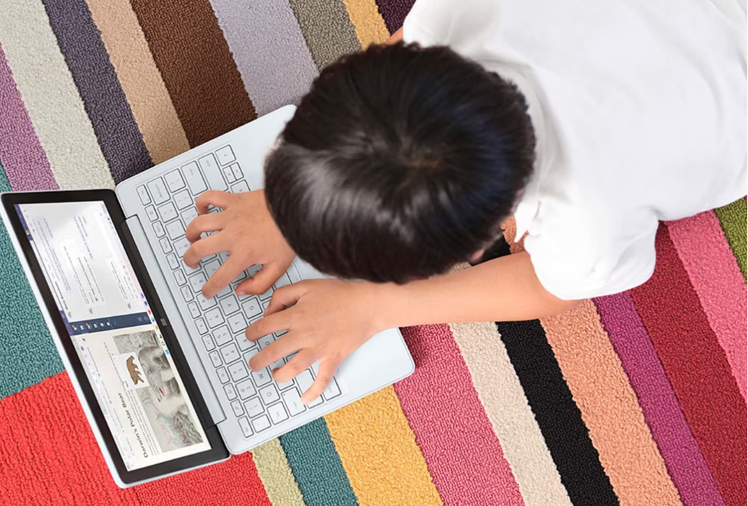 Surface Laptop SE kid using laptop