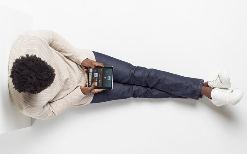 The Microsoft Surface Duo unleashes new, revolutionary possibilities for your work and mobile productivity. Male using Surface duo