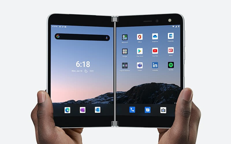 Simply span apps across both screens or view them side by side. Hand holding Suface-duo