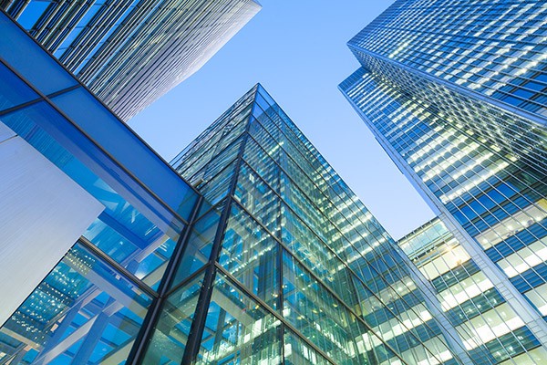 Prevent IP theft, fraud & cybercrime with RSA's security solutions Business building at dusk with lights on
