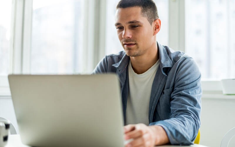 Veritas NetBackup Man working on laptop device